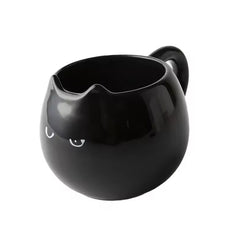 Adorable hand - painted cat - shaped ceramic mug, perfect for coffee or tea.